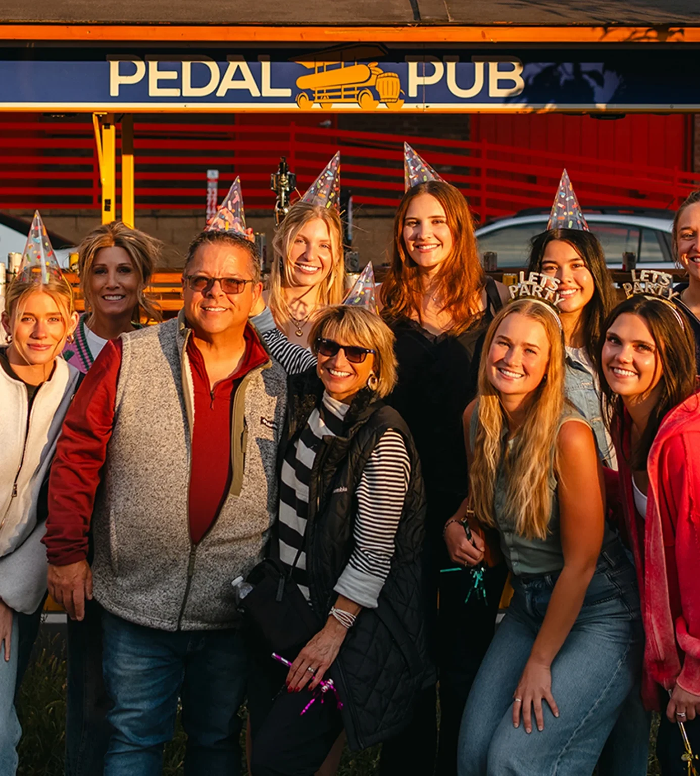 Family and friends celebrating a birthday party on a Pedal Pub