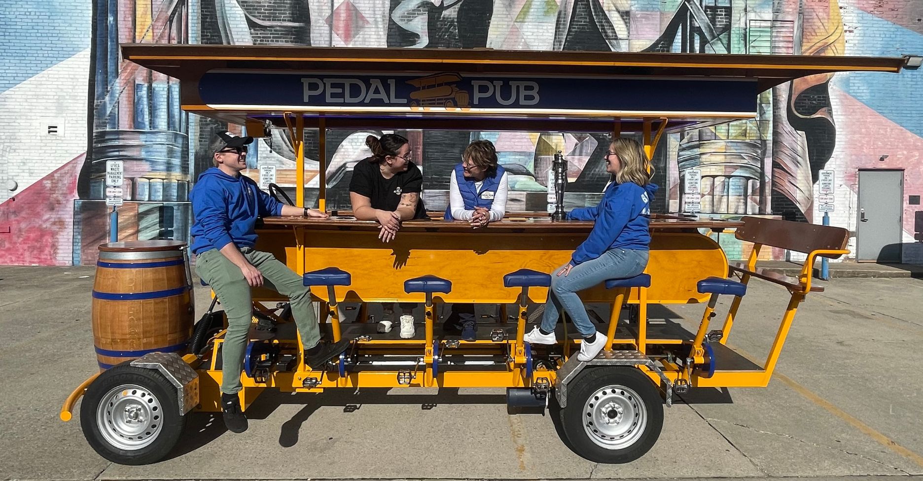 Pedal Pub Lexington owners on bike