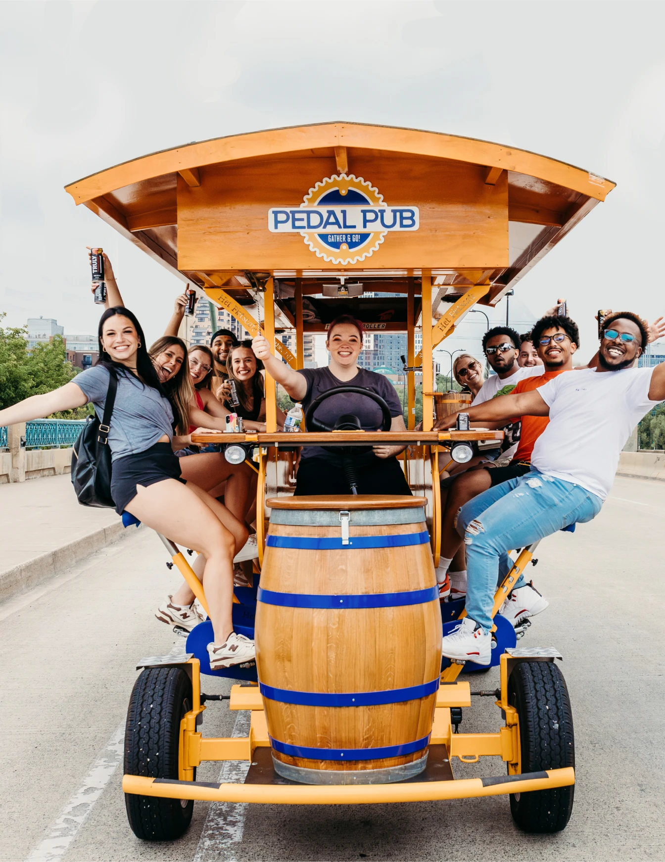 riders smiling on a party bike