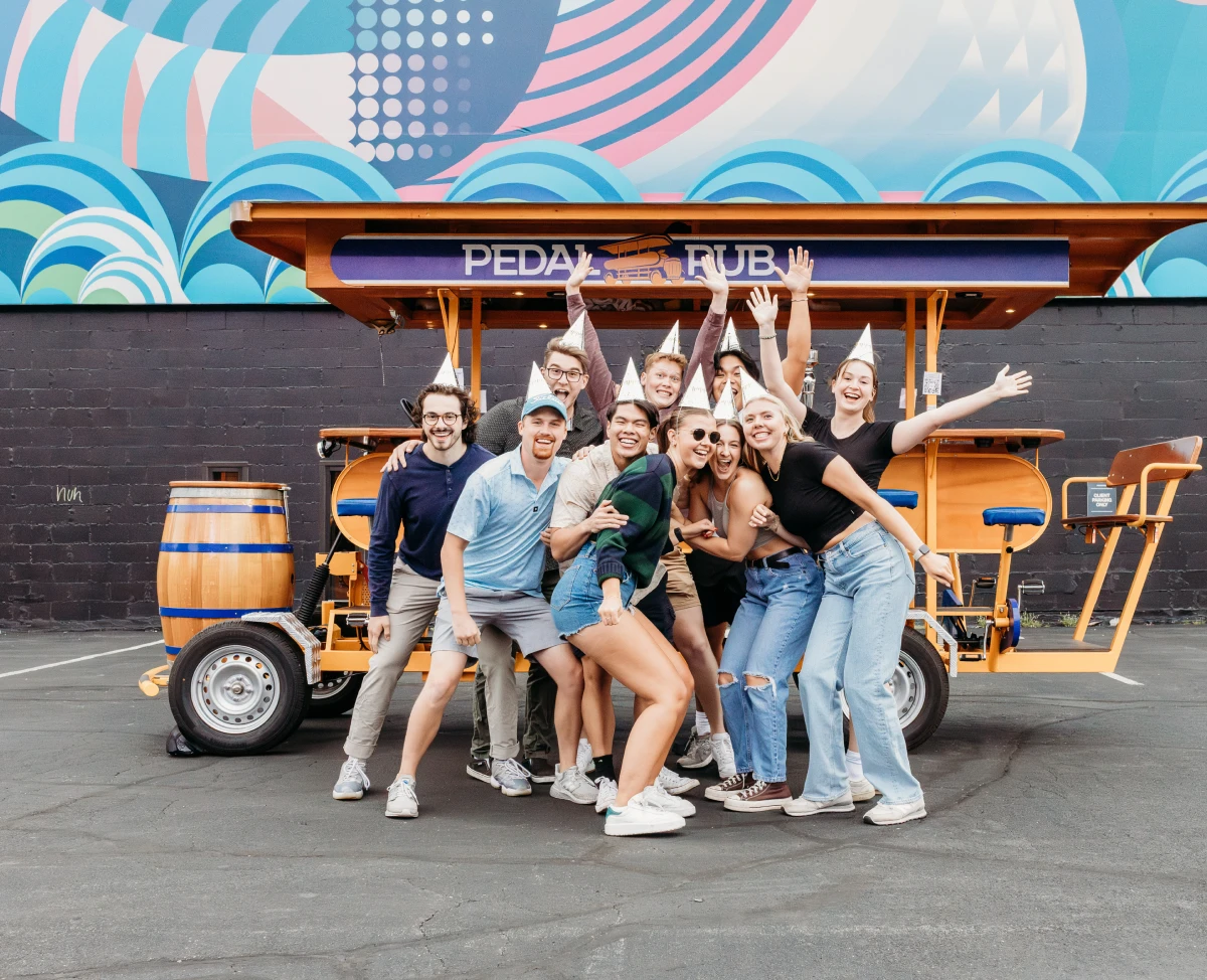 birthday party group in front of Pedal Pub