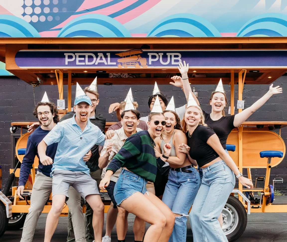 birthday party group in front of Pedal Pub