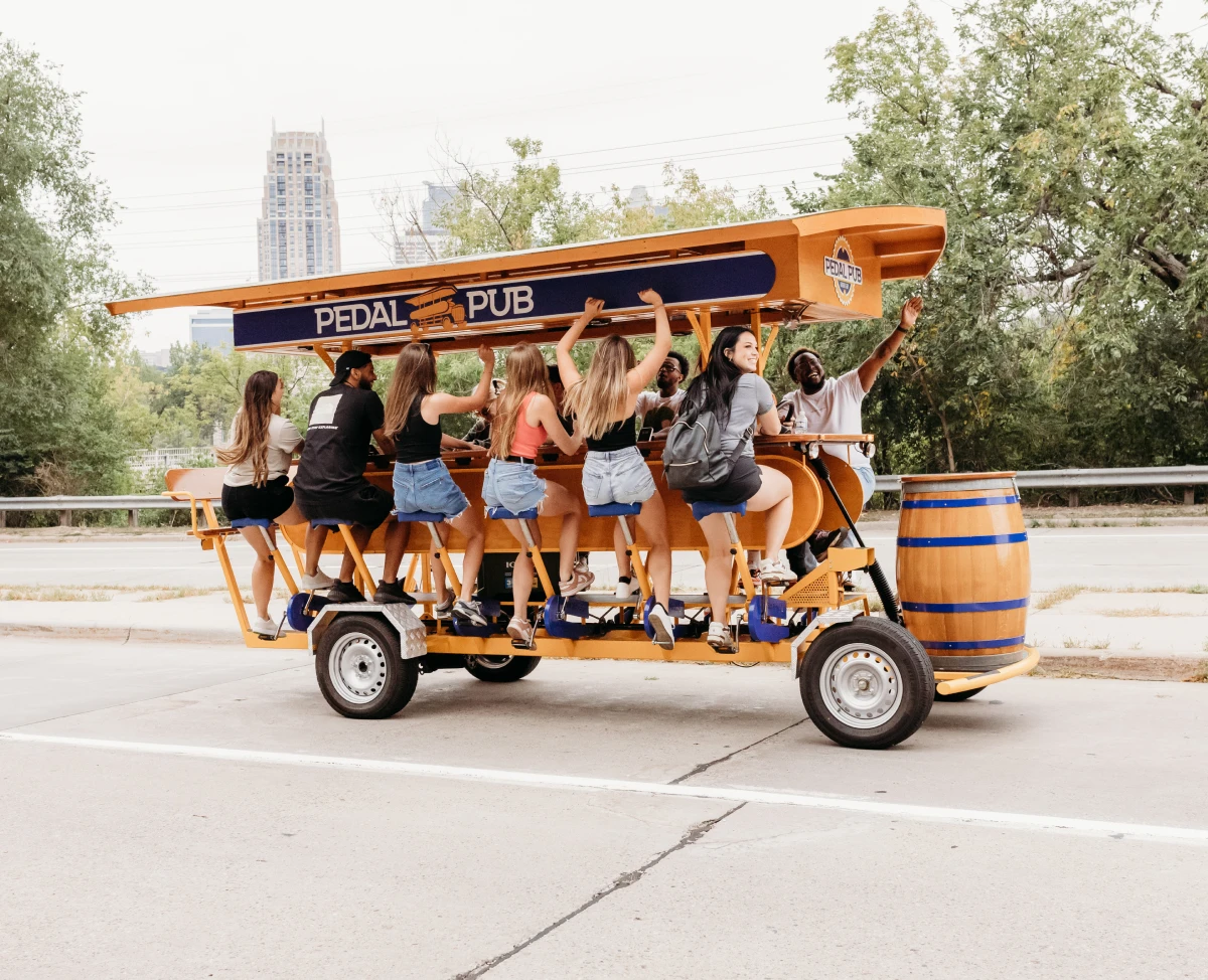 Pedal Pub tour traveling down street