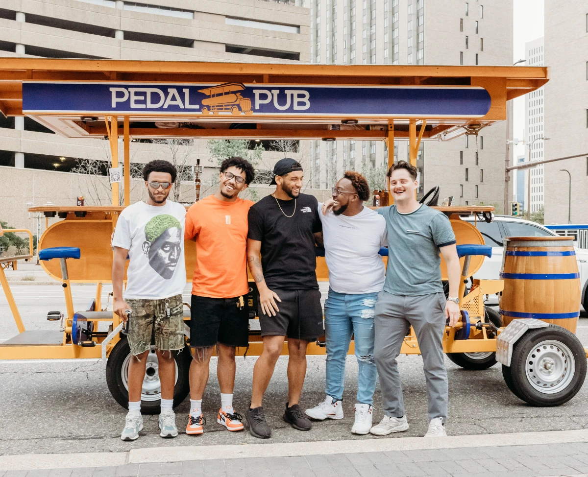 bachelor party in front of party bike