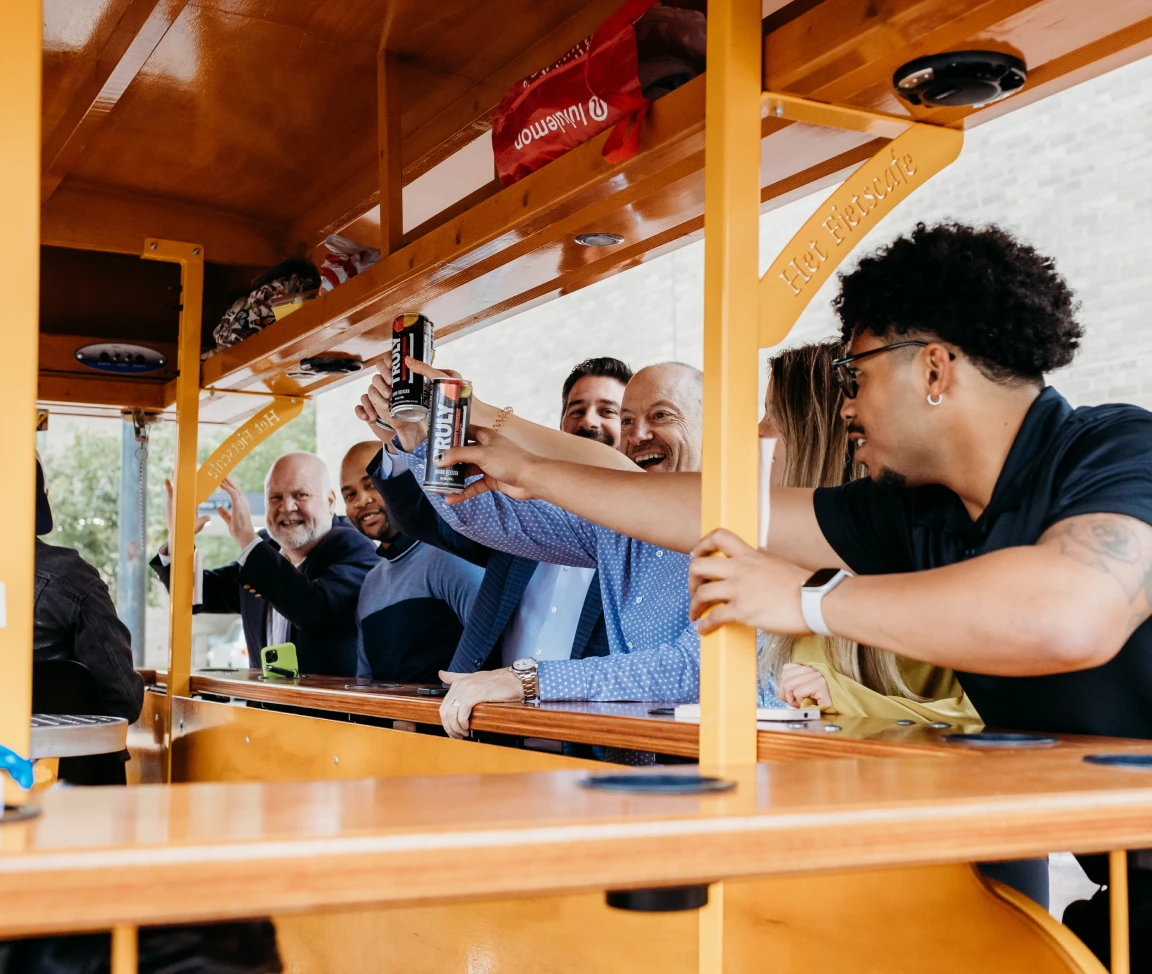 Pedal Pub riders cheersing drinks