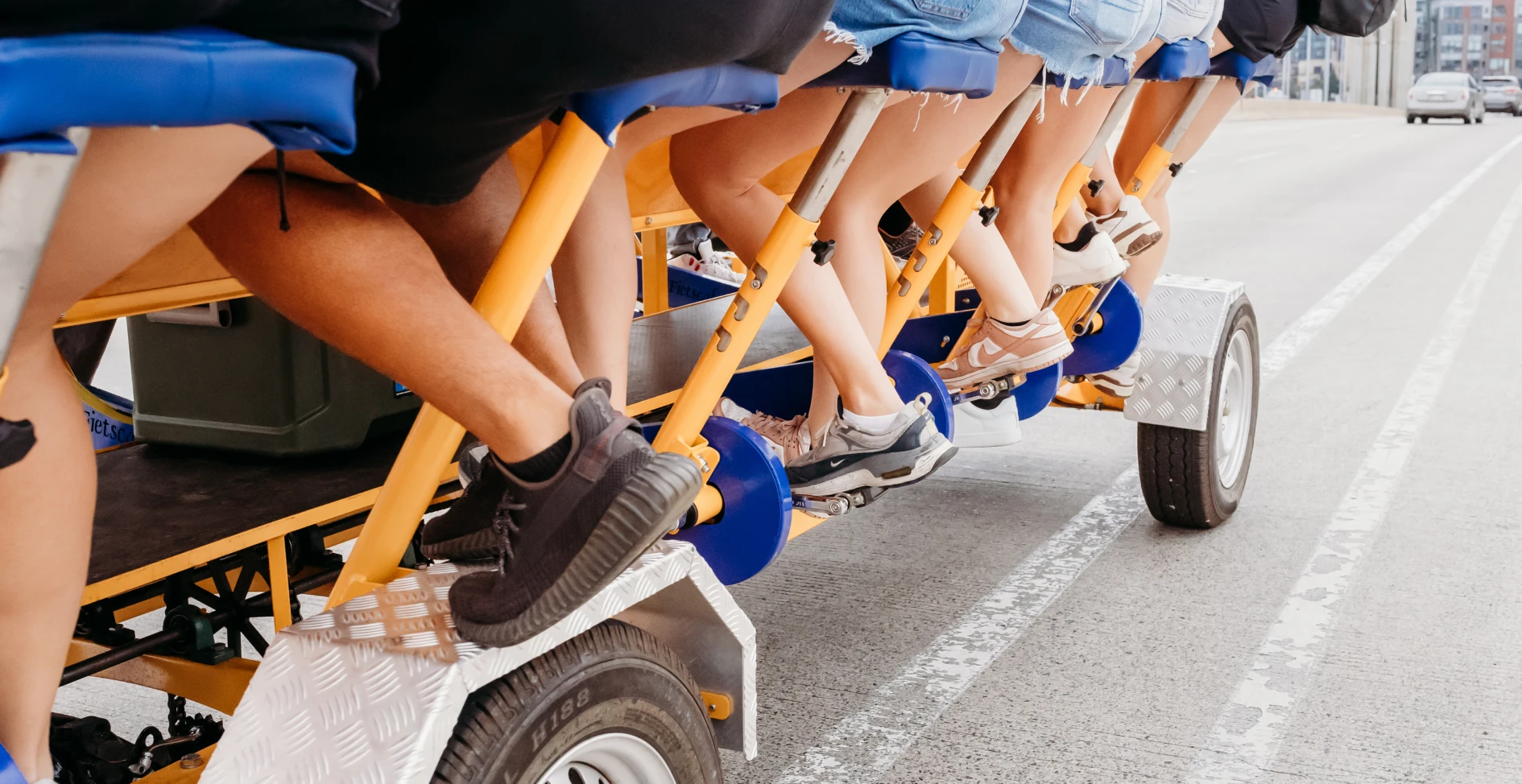 riders pedaling on a party bike